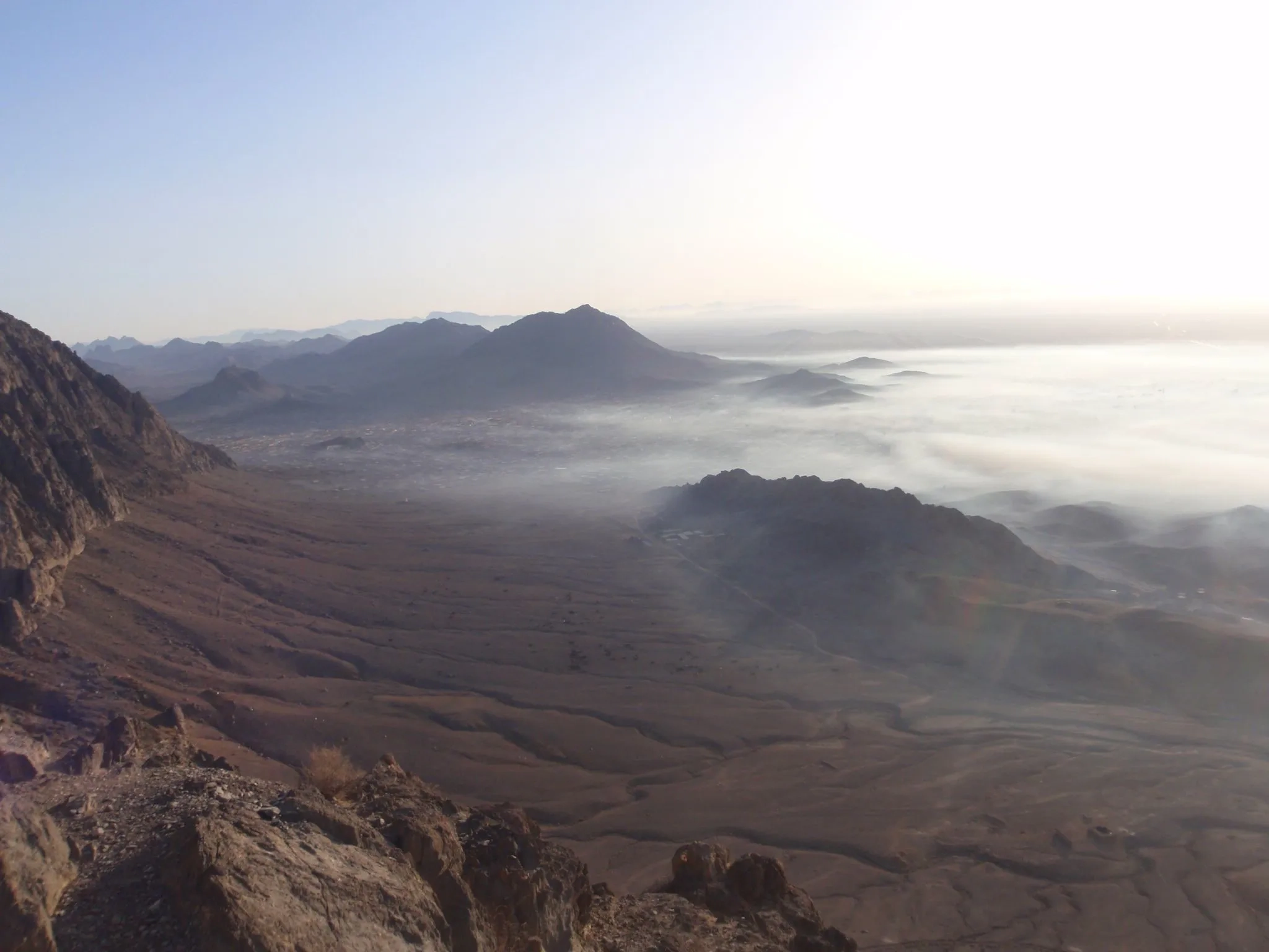 Mountain range covered in fog